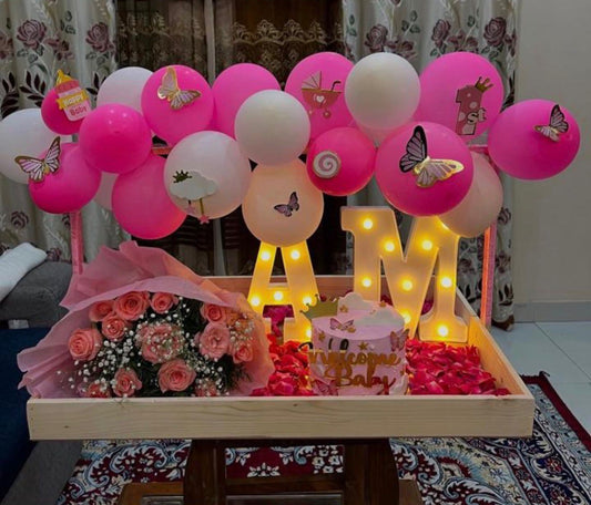 Pink butterfly balloon garland, personalized name letters, welcome baby cake and rose bouquet — Sweet Arrival baby gift set by Flower House Lahore