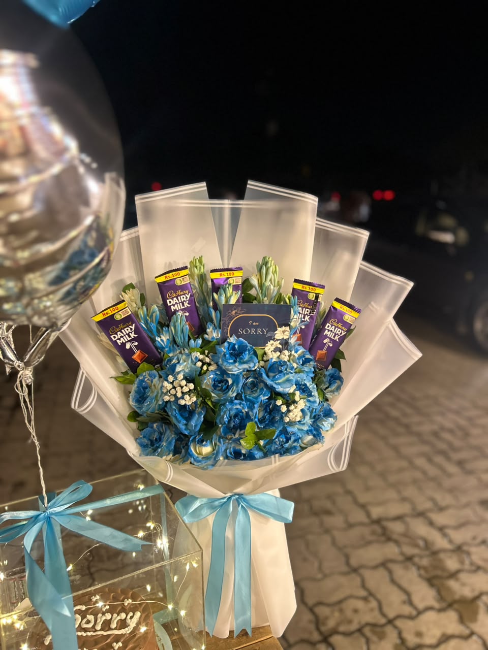 Blue rose and Cadbury chocolate bouquet and heart balloons — Blue Noir combo by Flower House Lahore