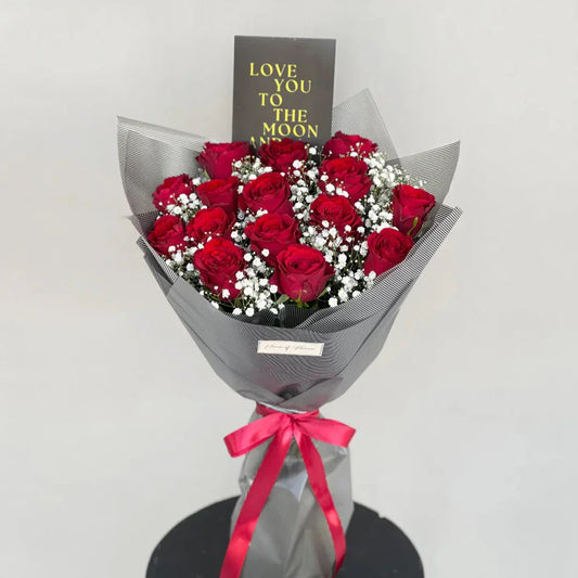 Bold Love premium red rose bouquet in black wrap