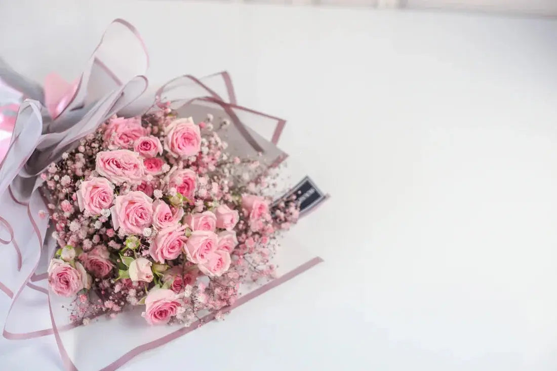 Close-up of pink roses and baby's breath, Gentle Bloom bouquet