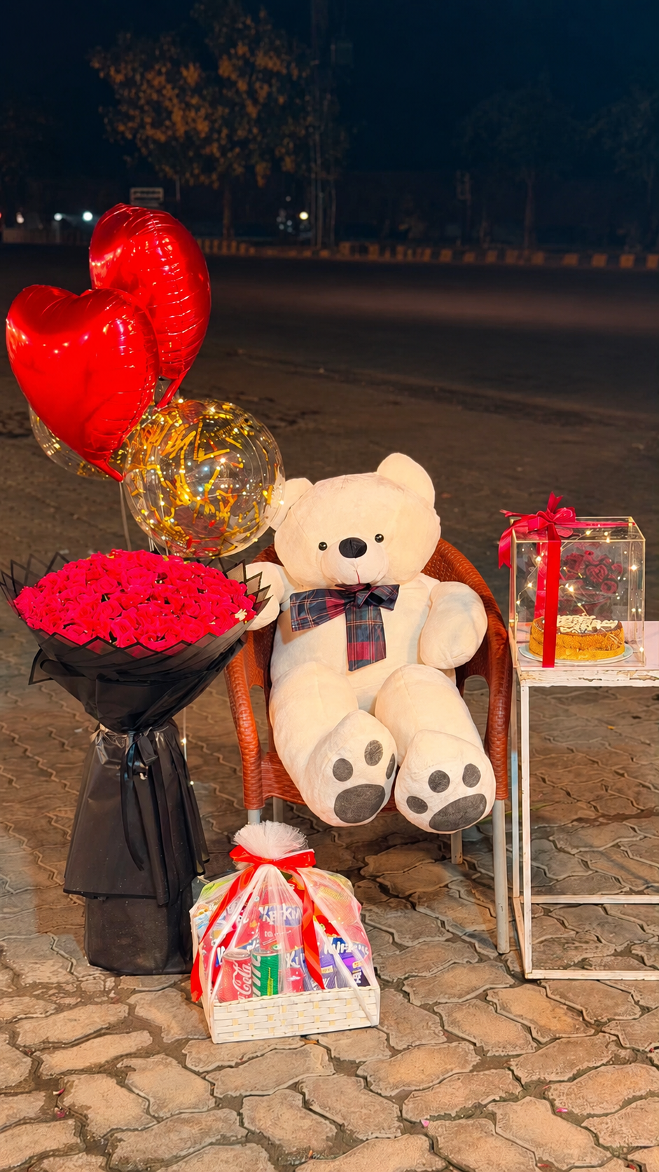 Giant teddy bear with red rose bouquet, heart balloons, gold confetti balloon, personalized cake and snack hamper — gift combo by Flower House Lahore