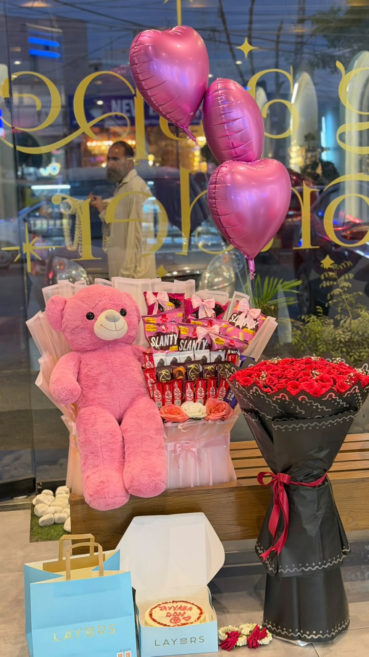 Pink teddy bear with snack bouquet, red rose bouquet, pink heart balloons and personalized cake — gift combo by Flower House Lahore