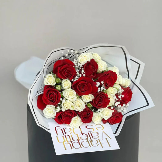 Close-up of red and white roses in Love You bouquet, neutral wrap