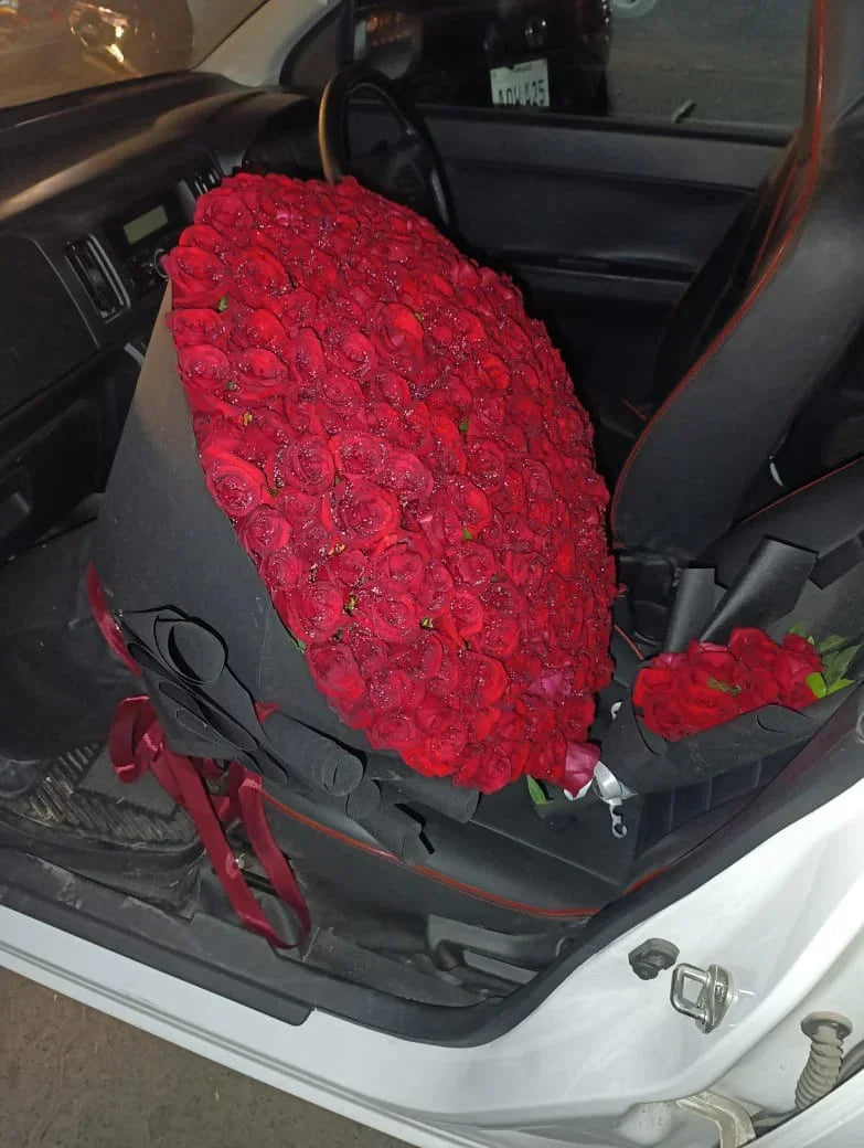 Premium hand-tied red rose bouquet with 500 flowers and black wrapping paper