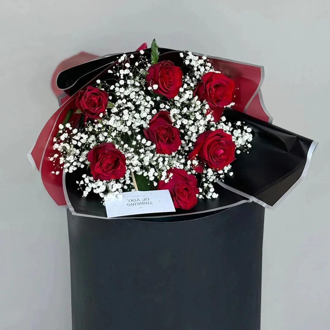 Close-up of 7 red roses proposal bouquet