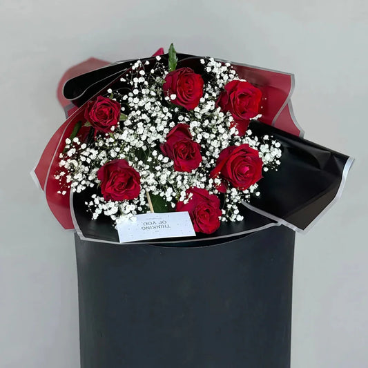 Close-up of 7 red roses proposal bouquet